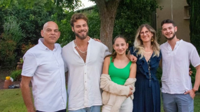 Alan Ohel (second from left) smiles with his family.